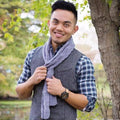 Close up of a cable knit scarf made from the Fun and Games Scarf Pattern