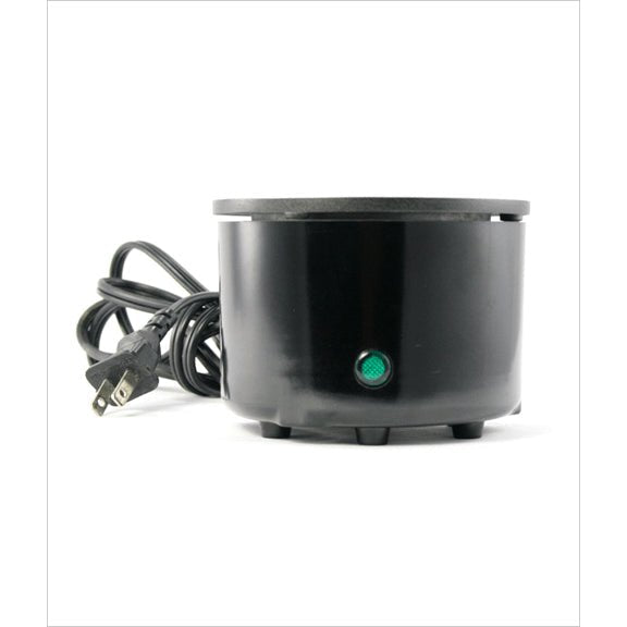 Fusion Glue Pot in solid gloss black metal, sitting on an industrial office desk
