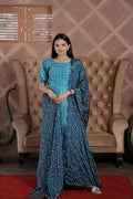 Woman wearing a blue muslin floral print A-line kurta with crush pleating, matching palazzo, and dupatta.