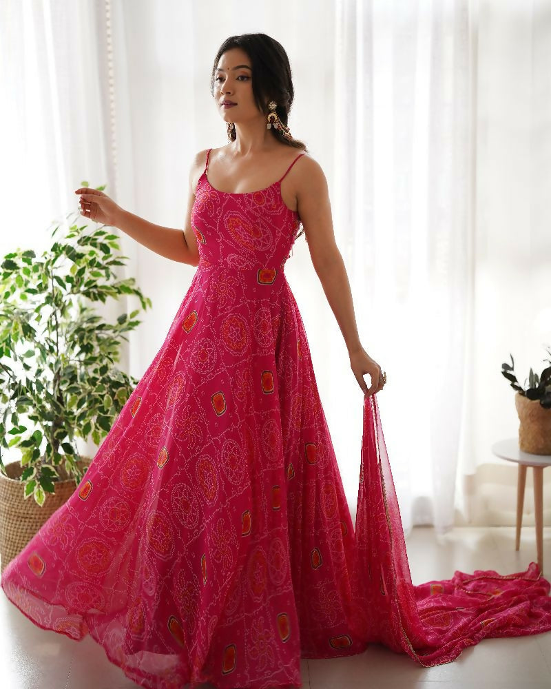 Woman wearing a pink chiffon kurta set with intricate sequin embroidery work