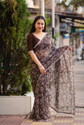 Coffee poly georgette saree with Warli prints, aari mirror work, and white patch lace