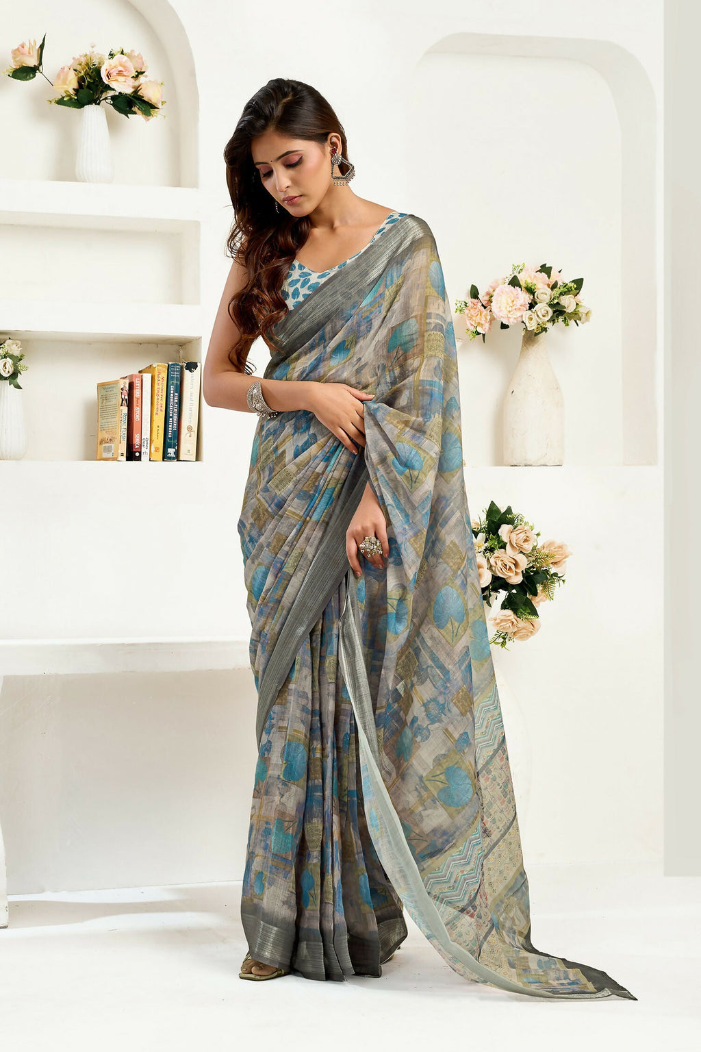 Dusty brown linen saree featuring floral and ethnic motifs with a matching unstitched blouse.