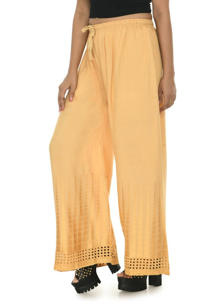 Golden rayon cotton palazzo pants with intricate cut work detailing