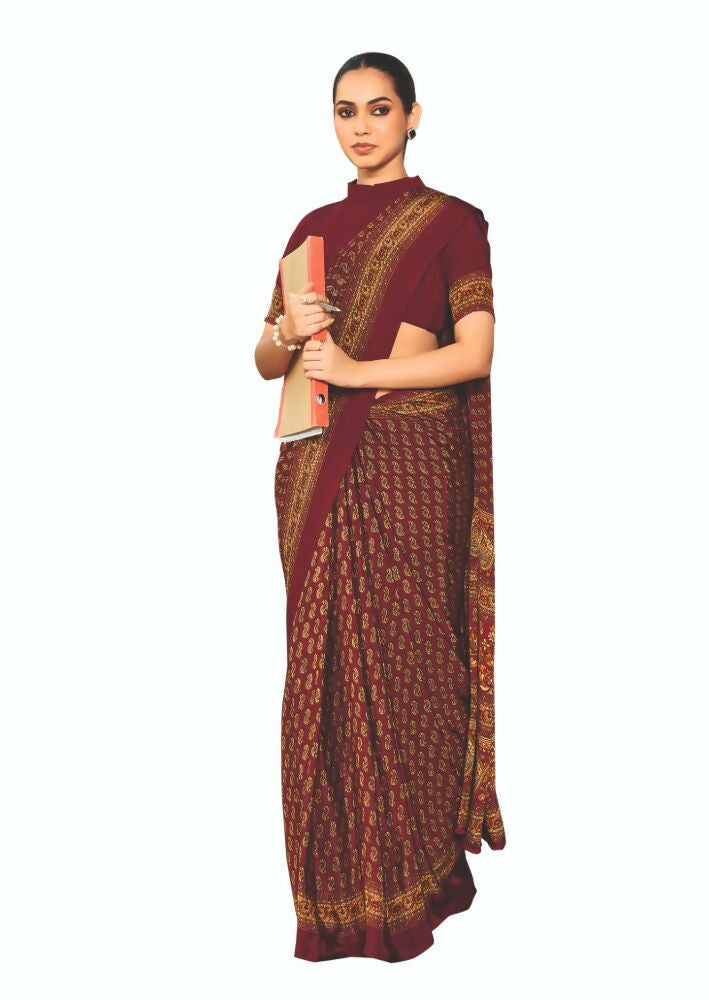 A beautiful red crepe silk saree featuring traditional prints, ideal for party wear.