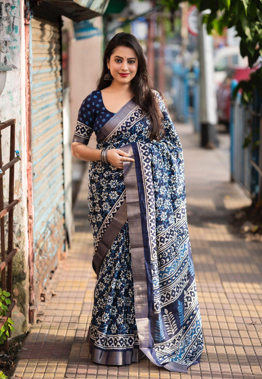 Blue poly silk saree with batik print and matching blouse piece