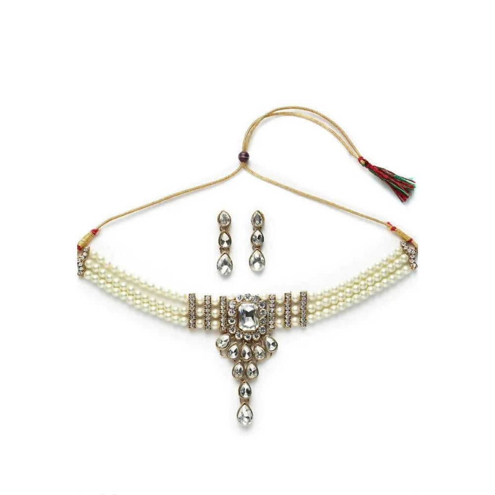 Traditional necklace set featuring detailed stone and pearl embellishments