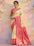 Luxurious cream soft silk saree with a smooth, elegant texture and matching blouse.