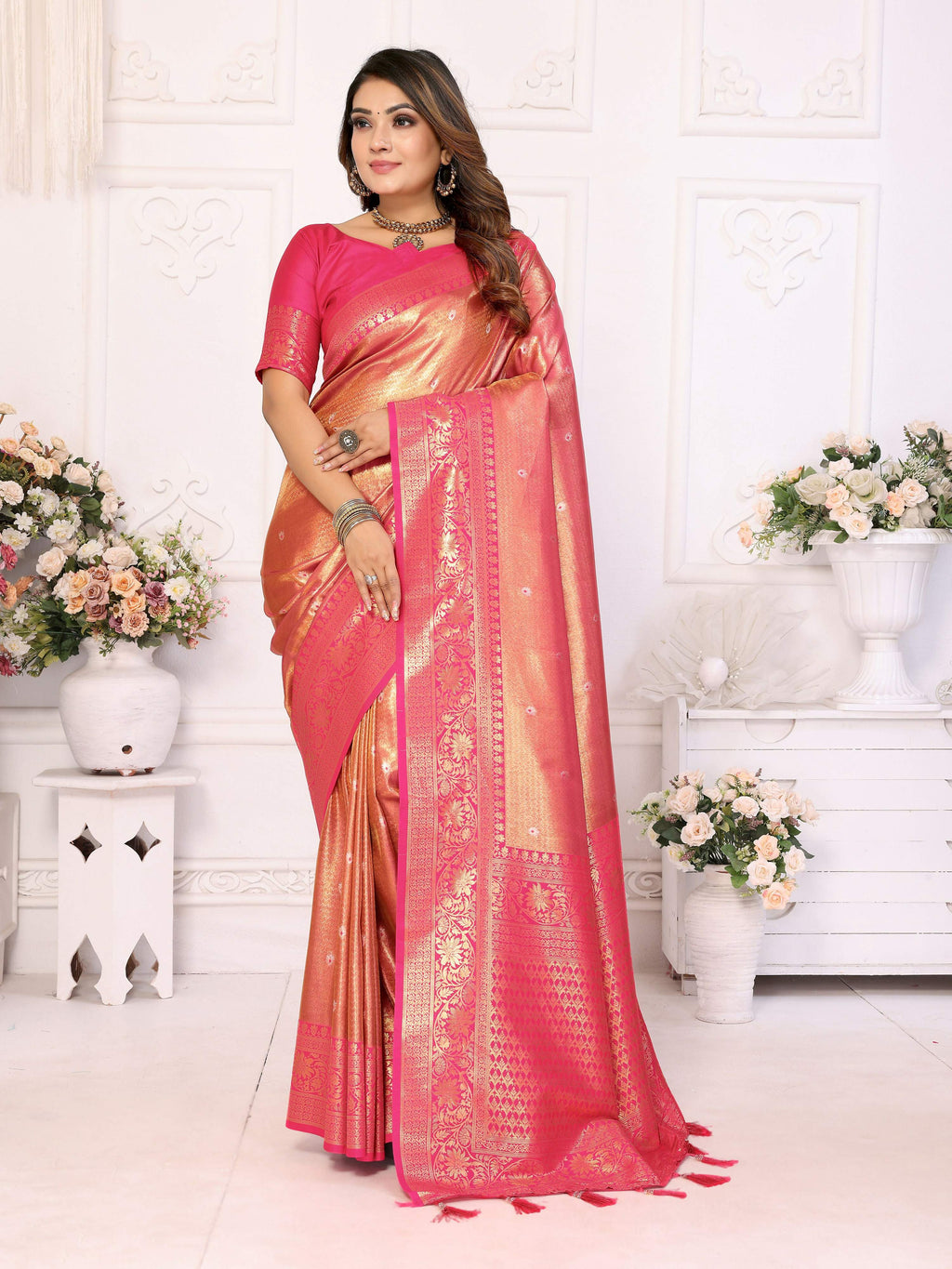 Pink tissue silk saree with woven details and light-reflecting sheen