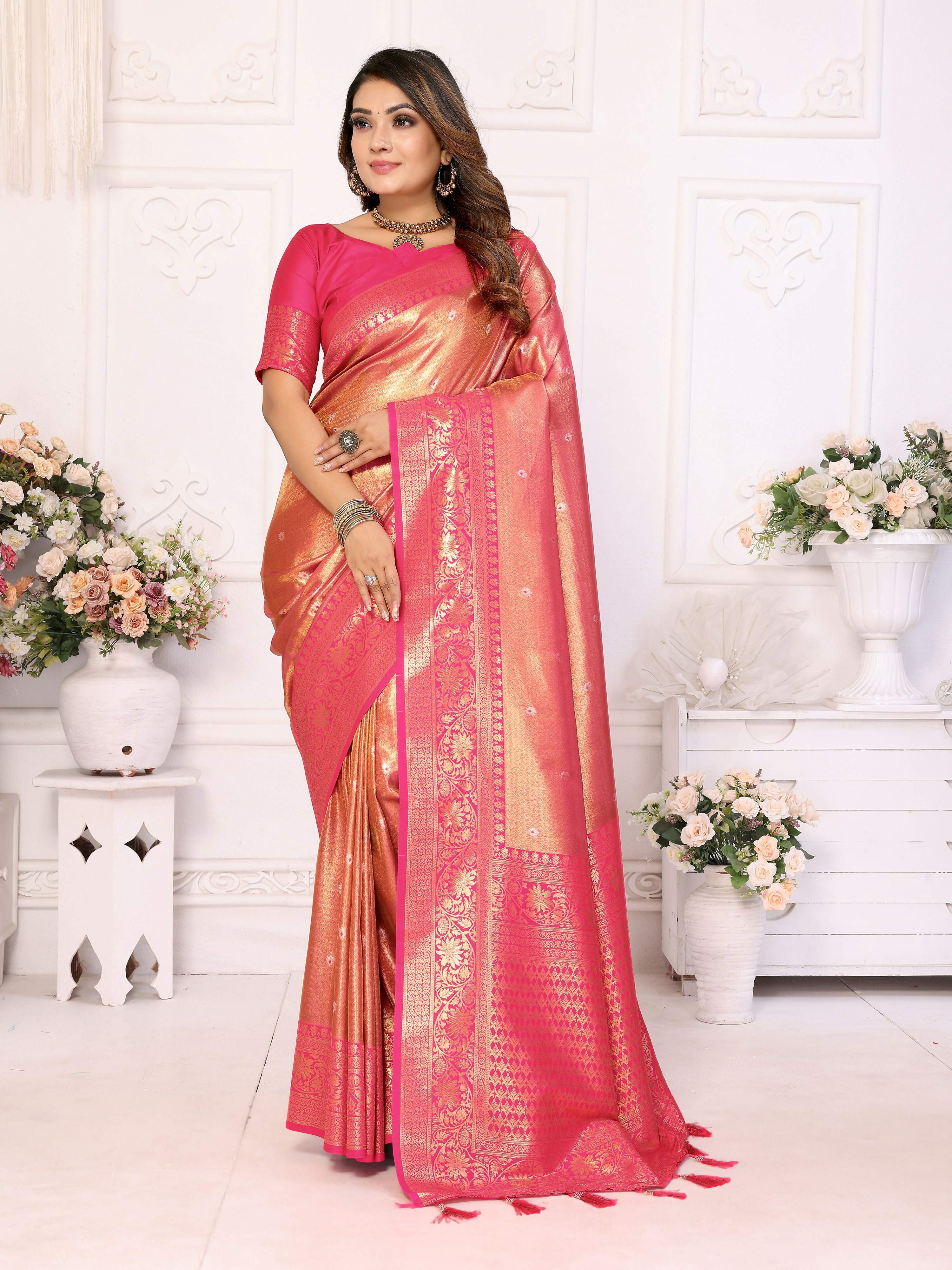 Pink tissue silk saree with woven details and light-reflecting sheen