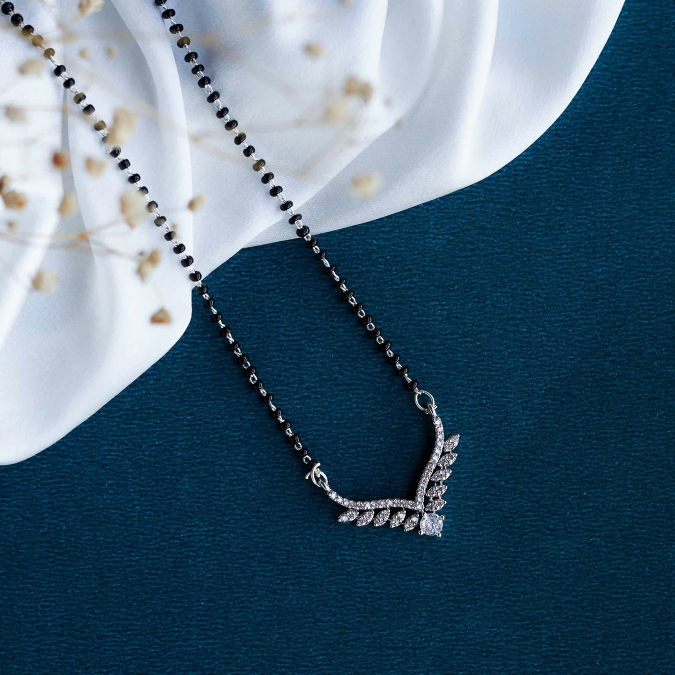Elegant white American Diamond Mangalsutra on a display background