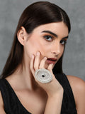 Round silver-tone statement ring with intricate patterns and embedded sparkle stones