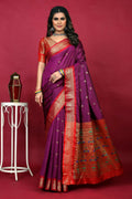 Purple Paithani silk saree with Zari work and a red blouse