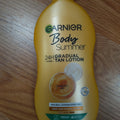 Bottle of Garnier Summer Body Deep Sun-Kissed Moisturizing Lotion 400ml