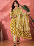 Model wearing a printed mustard pure cotton kurta set with a graceful ethnic design.