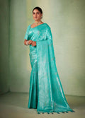 Glamorous Turquoise Kanjivaram Silk saree with weaving work and matching tassel fringe