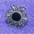 Detailed view of a uniquely designed black fashion ring for women