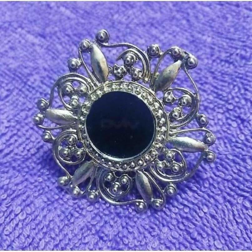 Detailed view of a uniquely designed black fashion ring for women