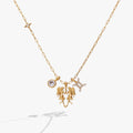 Gold-plated Gemini zodiac charm cluster necklace with crystal-pave twin motif.