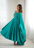 Model wearing a 3-piece Rama colored Chanderi kurta set with detailed sequence embroidery work.