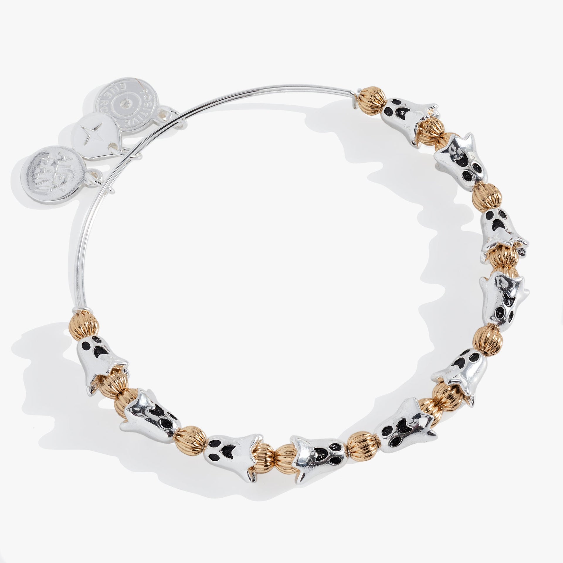 Two-tone beaded bangle featuring ghost-shaped beads and gold accents.