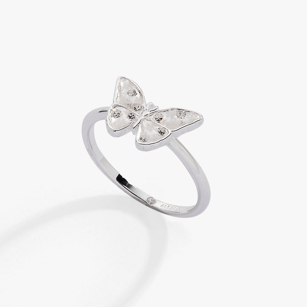 Silver butterfly statement ring featuring white enamel, snowflake etchings, and sparkling stones.