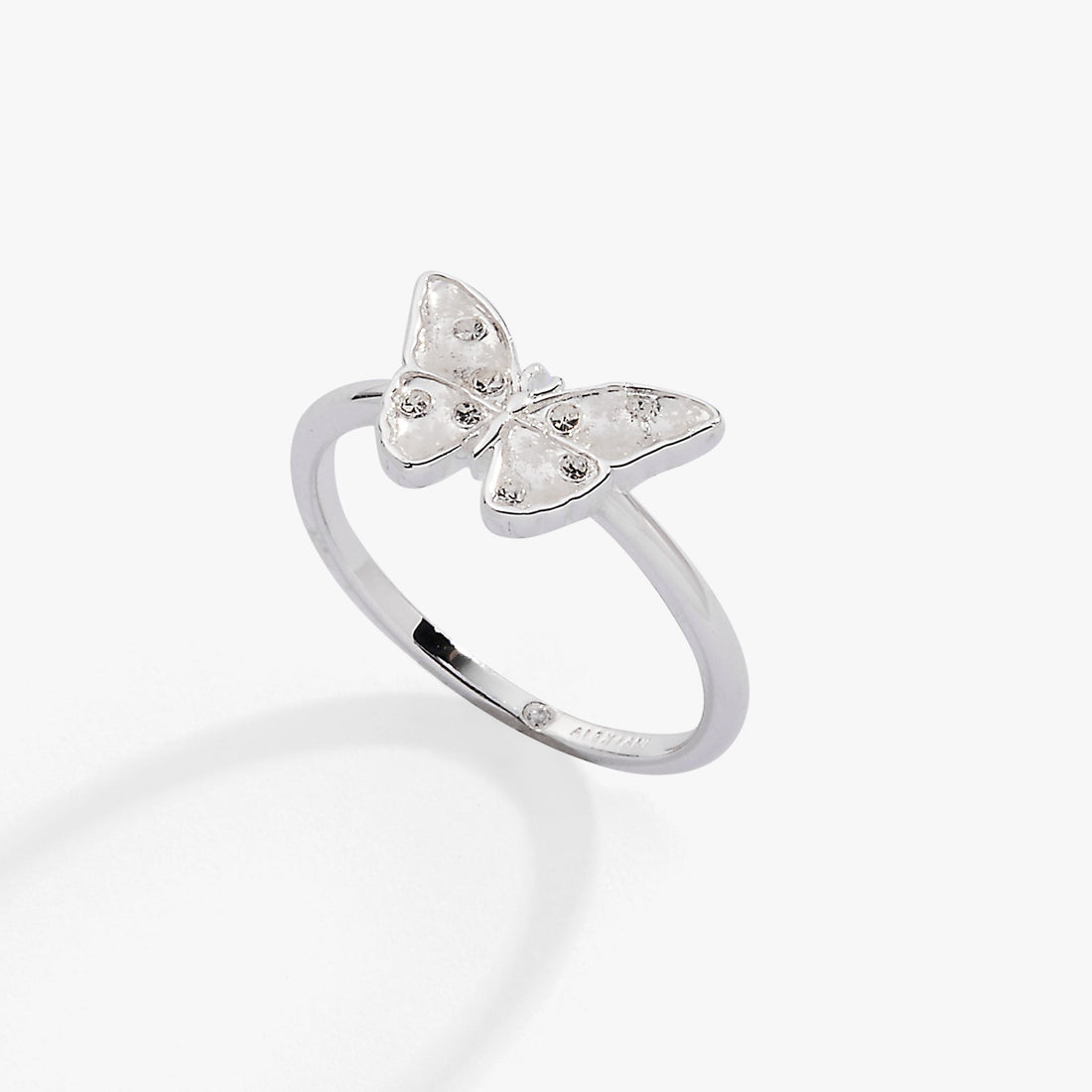 Silver butterfly statement ring featuring white enamel, snowflake etchings, and sparkling stones.