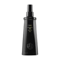 Glossy black bottle of Oribe Foundation Mist with gold text branding