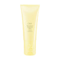 A jar of Oribe Hair Alchemy Strengthening Masque, a professional hair treatment for damaged, brittle hair.