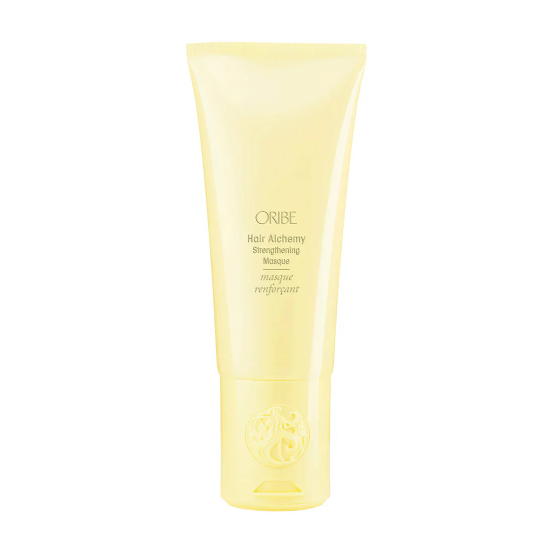 A jar of Oribe Hair Alchemy Strengthening Masque, a professional hair treatment for damaged, brittle hair.