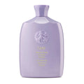 Oribe Serene Scalp Oil Control Shampoo in a signature lavender bottle.