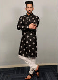 A luxurious black silk kurta decorated with elegant copper sequence embroidery.