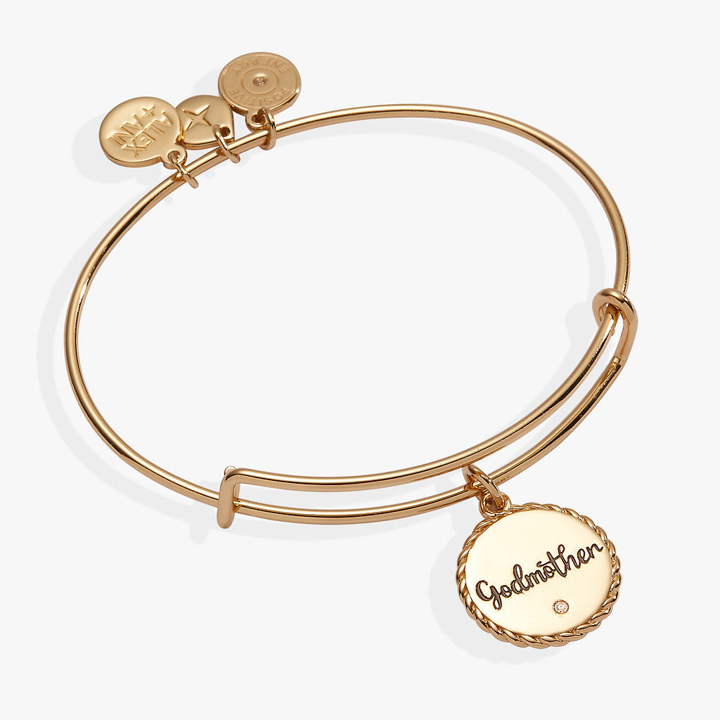 Godmother charm bangle in gold and silver finish with crystal accent on white background.