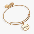 Godmother charm bangle in gold and silver finish with crystal accent on white background.