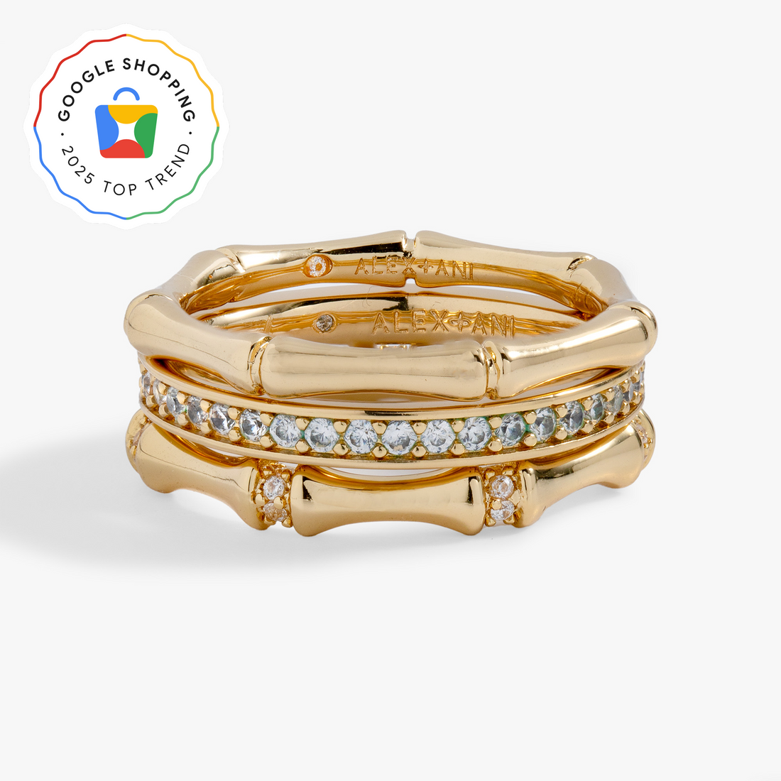 Alex And Ani Bamboo Trio Ring Set featuring two gold-tone bamboo motif bands and one pave crystal center ring