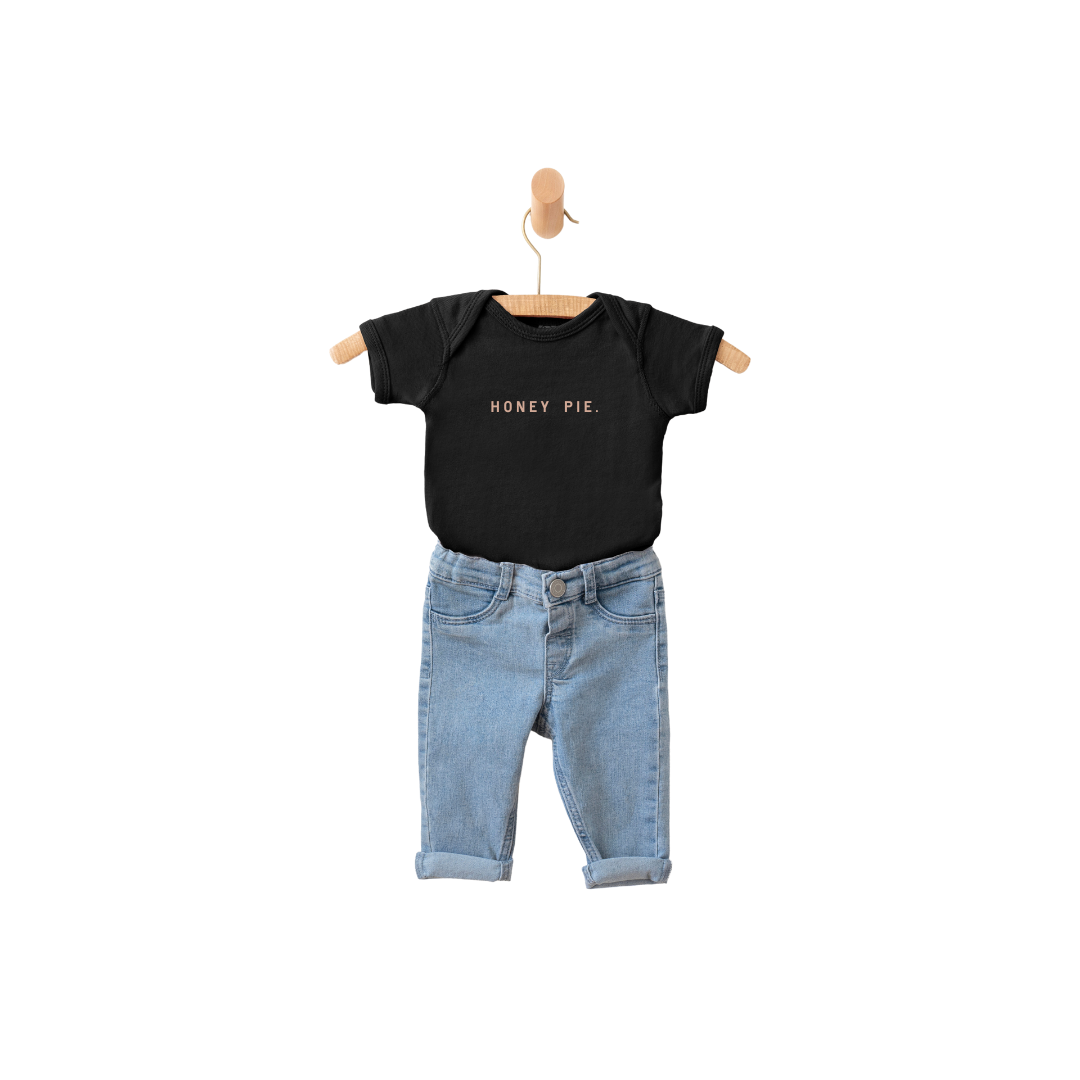 Minimalist Honey Pie graphic onesie in black and white cotton