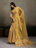 Elegant beige tissue silk saree with a matching blouse.