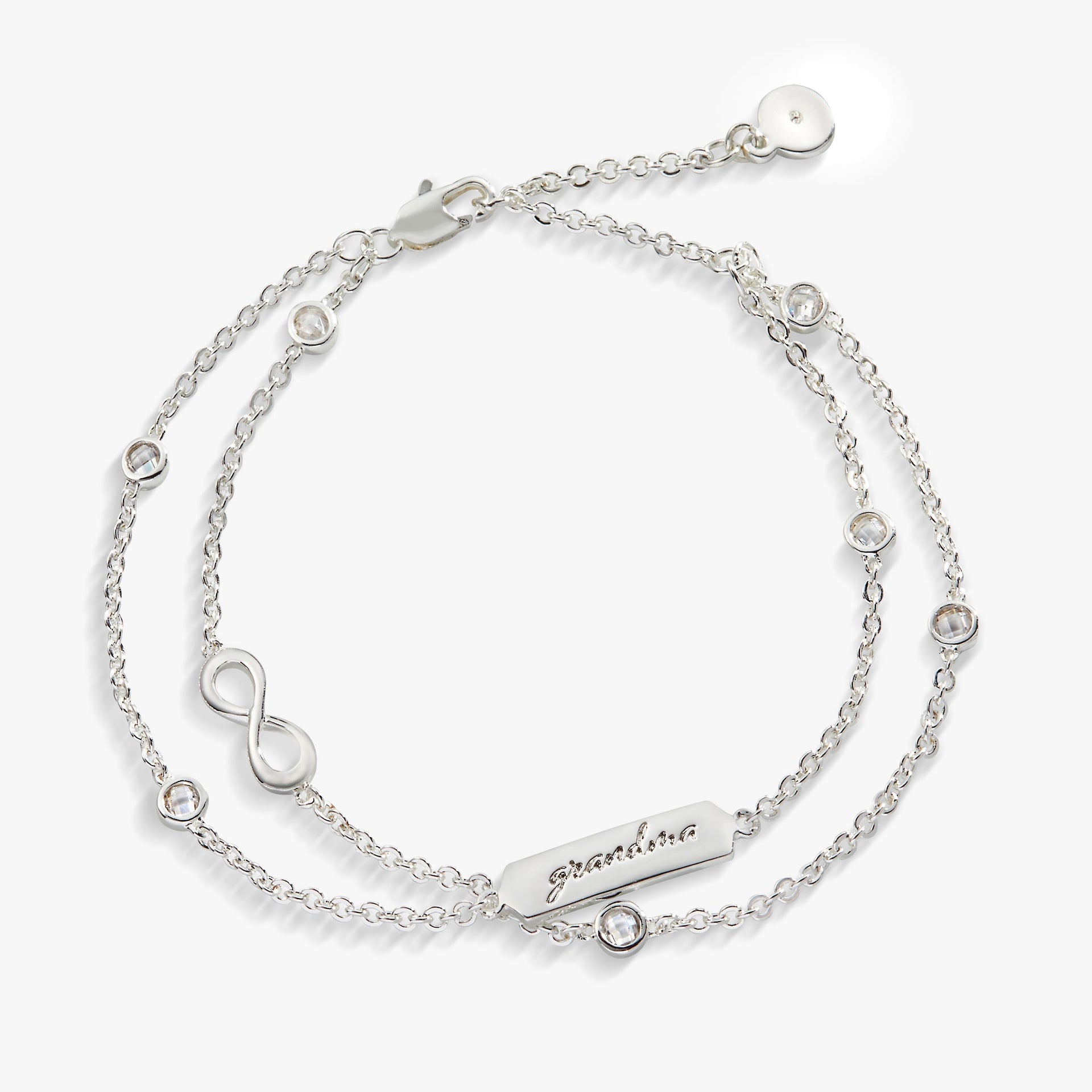Double strand chain bracelet featuring an infinity symbol charm in gold and silver.