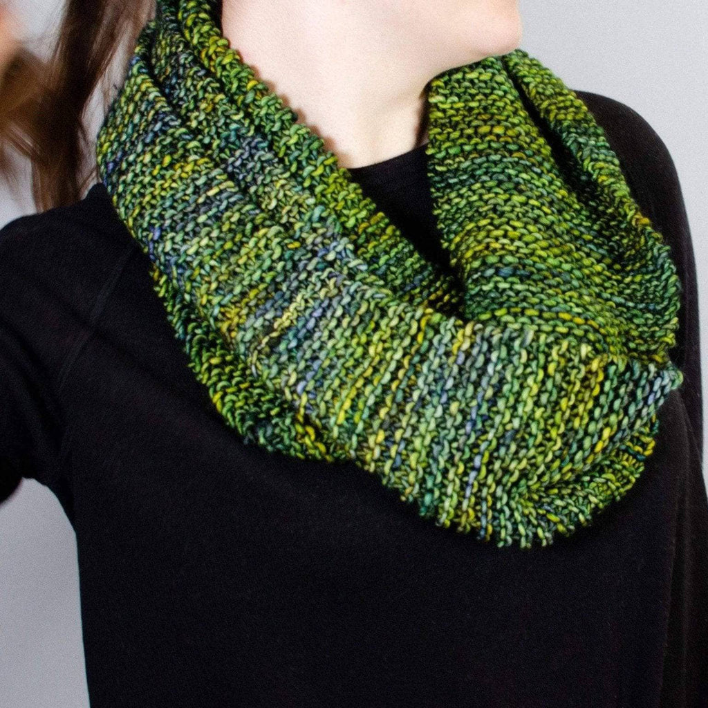 Close up of the Green Goddess Infinity Scarf knit pattern showing texture and stitch detail.