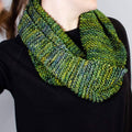Close up of the Green Goddess Infinity Scarf knit pattern showing texture and stitch detail.
