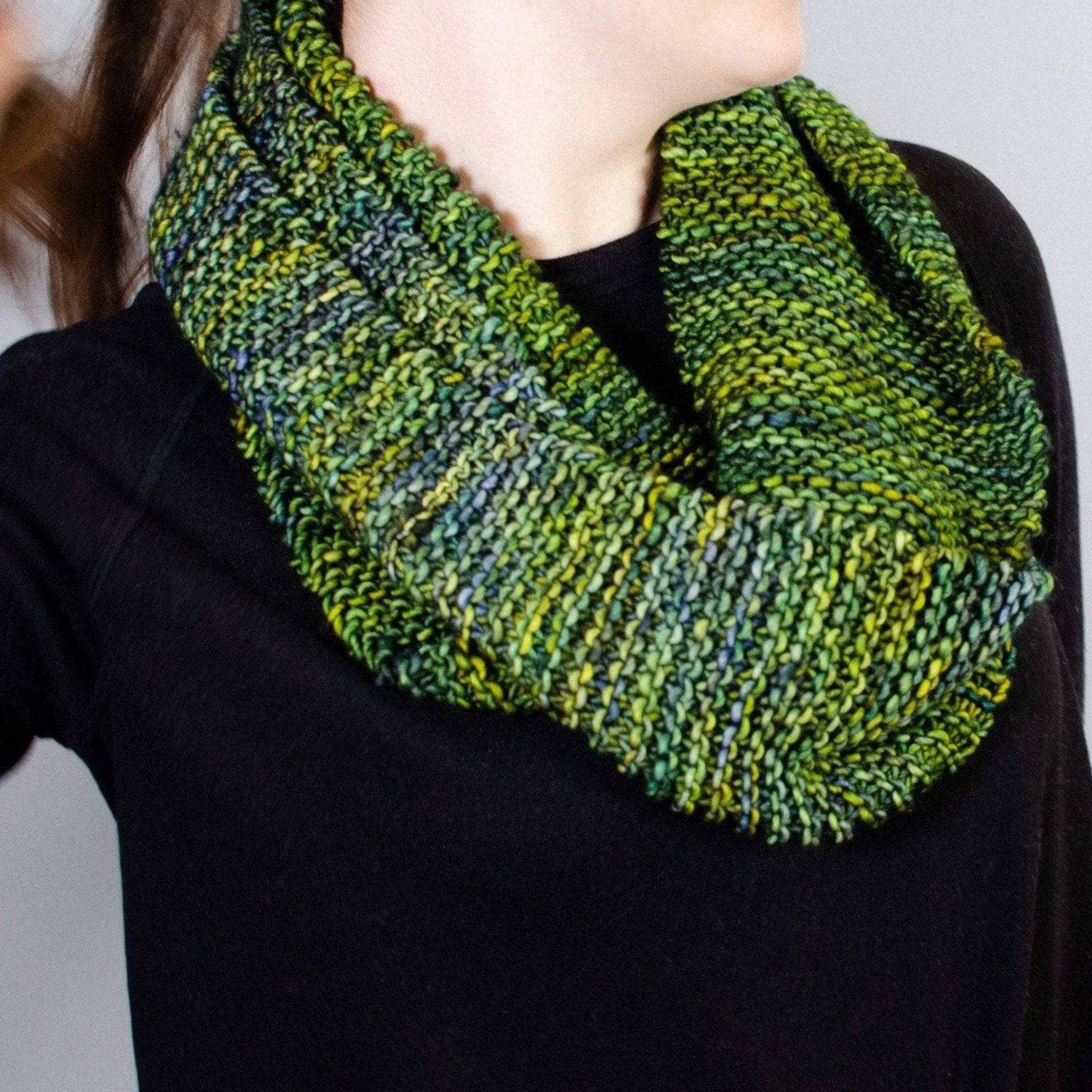 Close up of the Green Goddess Infinity Scarf knit pattern showing texture and stitch detail.
