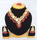 Close up of red Kundan necklace set with gold plated finish