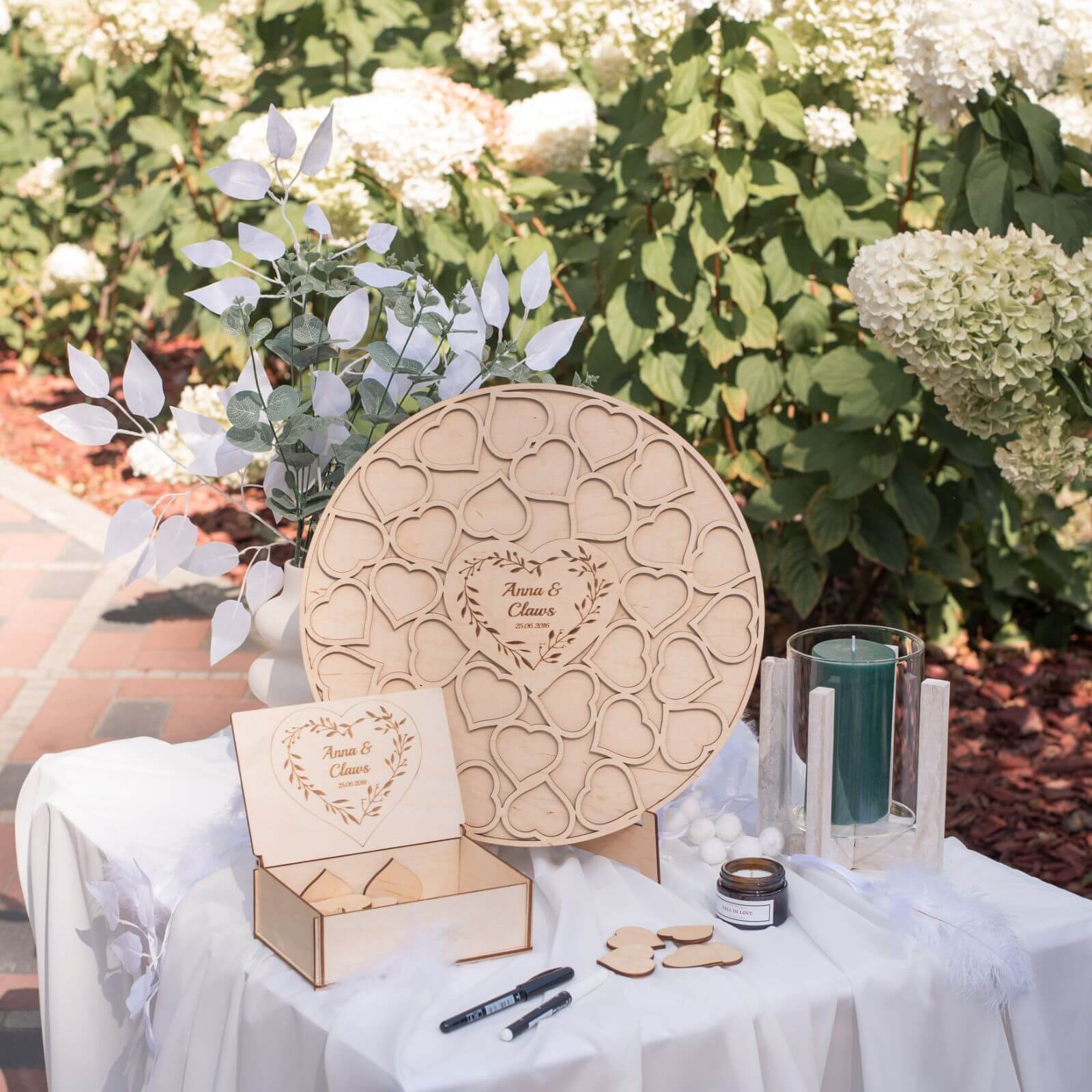 Minimalist wooden circular wedding guest book displayed as home decor in a neutral living room setting.
