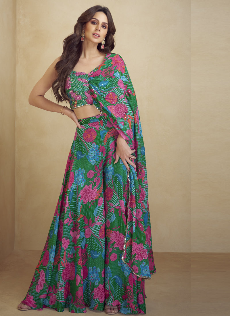 Model wearing a green Chinon silk western suit with digital print and Gota Patti embroidery