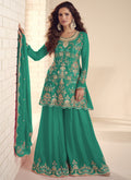 A vibrant Rama Green Chinon silk palazzo suit featuring intricate gota patti embroidery.