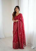 Pink georgette saree featuring delicate foil work and intricate zalar lace trim