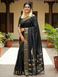 Woman wearing a elegant black soft silk saree with a matching blouse