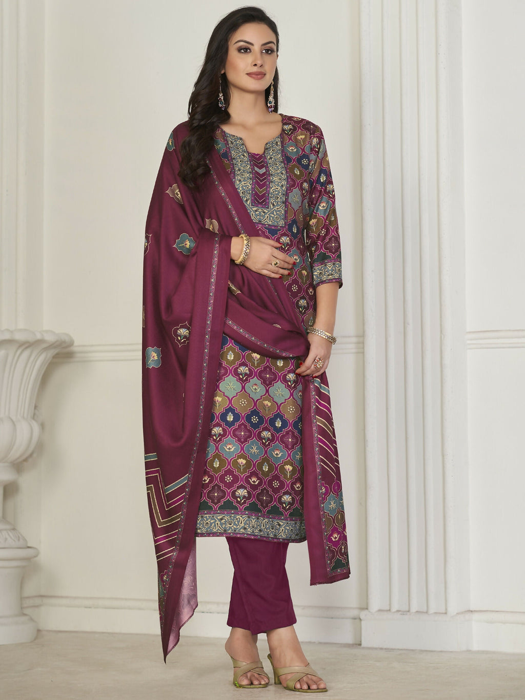 Woman wearing a multicolor Pashmina digital printed straight kurta set with trousers and a matching dupatta.