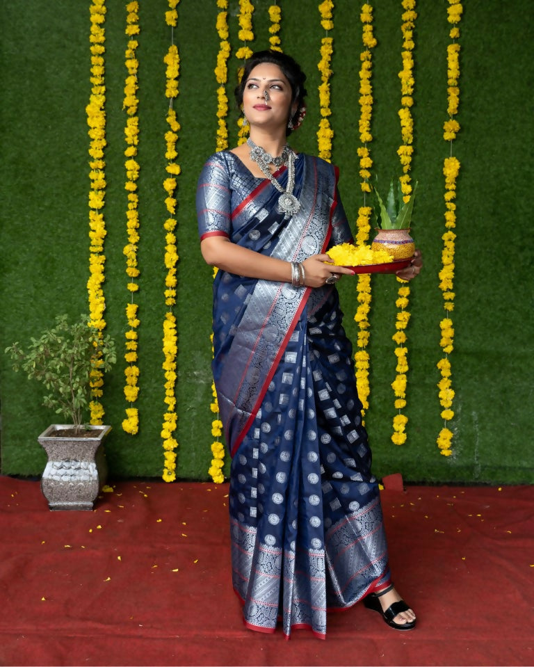 Navy blue soft handloom silk saree with detailed zari weaving and matching blouse fabric