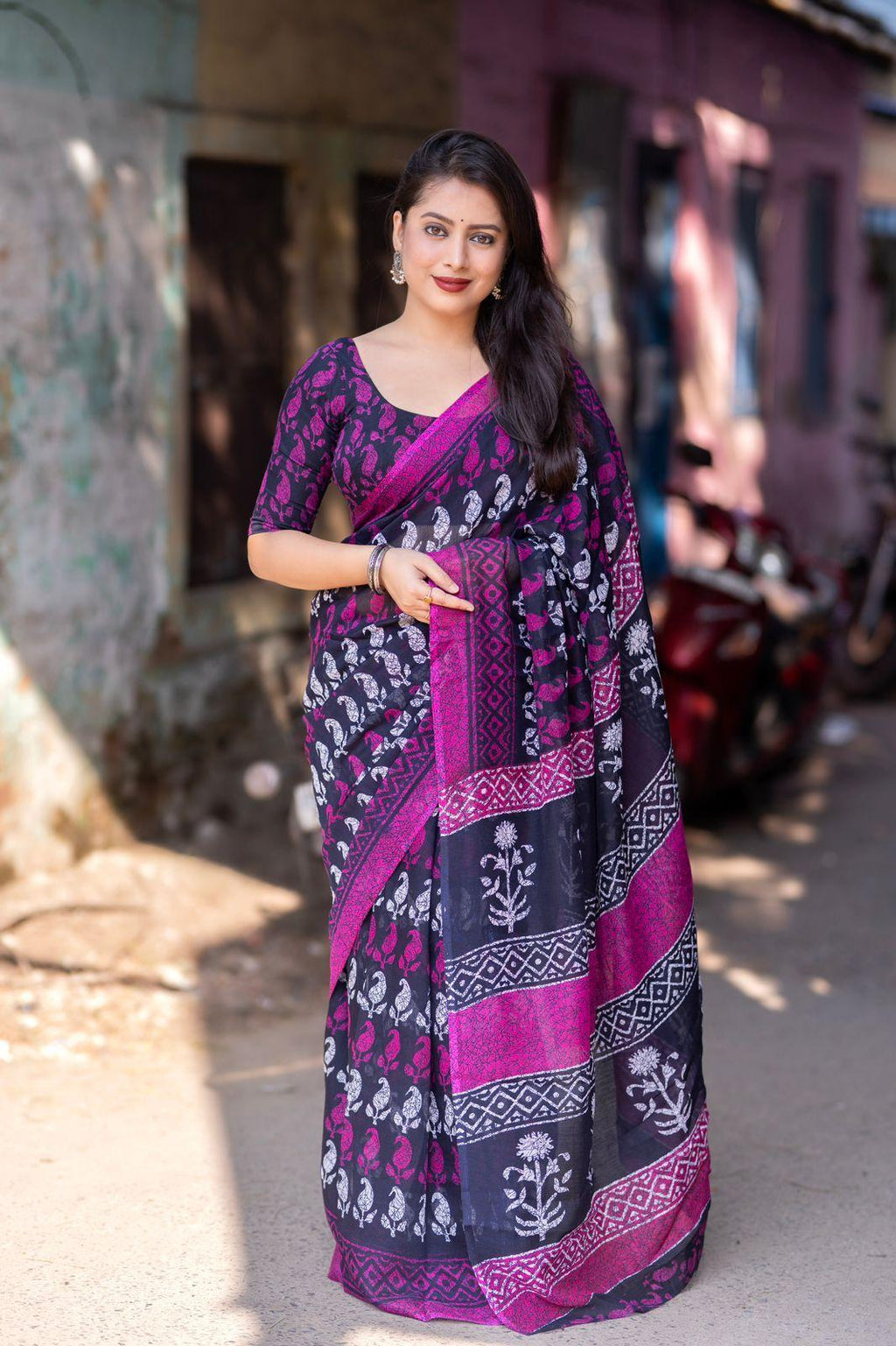 Purple linen blend saree with ethnic motif prints and matching unstitched blouse