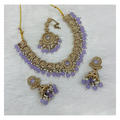 Exquisite lavender stone work necklace set with matching drop earrings on a neutral background